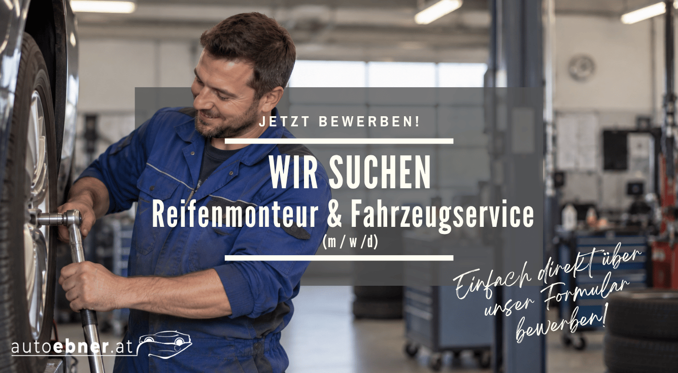 Bild: Mann montiert einen Autoreifen.